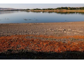 The exposed bed of the Arlington Reservoir, operated by South East Water Ltd., near Polegate, UK, on Friday, Aug. 12, 2022. Extreme heat and dry weather are putting intense pressure on England's water supply. Photographer: Carlos Jasso/Bloomberg