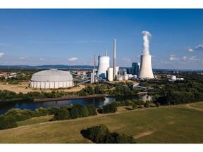 Vapor is released from a cooling tower at the Staudinger coal and gas power plant, operated by Uniper SE, on the banks of the River Main, a tributary of the River Rhine, in Grosskrotsenberg, Germany, on Tuesday, Aug. 16, 2022. Uniper reported a loss of more than 12 billion euros ($12.2 billion), ranking among the biggest in German corporate history and laying bare the unprecedented crisis engulfing Europe's energy markets.