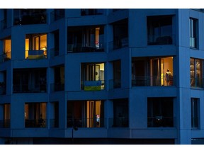 A partially lit block of apartments at dusk in Berlin, Germany, on Tuesday, Aug. 16, 2022. Germany's government has asked citizens, municipalities and industrial consumers to save energy, and efforts can be seen across the country.