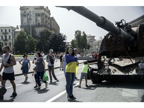 Visitors at an exhibit of Ukrainian military equipment on Khreschatyk Street ahead of Independence day, in Kyiv, Ukraine, on Monday, Aug. 22, 2022. Ukrainian President Volodymyr Zelenskiy has warned that Russia "may try to do something particularly nasty, particularly cruel" as Ukraine prepares to celebrate Independence Day on Wednesday, which also marks six months since the invasion.