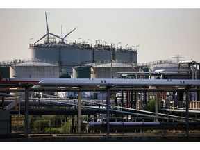 Pipelines and storage tanks at the Evos Hamburg GmbH petroleum products facility in the Port of Hamburg. Photographer: Krisztian Bocsi/Bloomberg