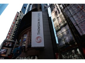 NEW YORK - APRIL 17: The new logo of Thomson Reuters is seen on their Times Square building April 17, 2008 in New York. Thomson Reuters Corporation debuted on April 17 with a new logo as a global information company.