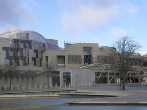 FILE - This file photo taken March 16, 2014 shows a general view of the Scottish Parliament in Edinburgh, Scotland. A law has come into force in Scotland to ensure period products are available free of charge to anyone who needs them. The Scottish government said it became the first in the world to legally protect the right to access free period products when its Period Products Act came into force Monday.