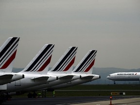 FILE - Air France planes are parked on the tarmac at Paris Charles de Gaulle airport, in Roissy, near Paris, May 17, 2019. Air France pilots are under scrutiny after recent incidents that have prompted French investigators to call for tougher safety protocols. An airline official said two Air France pilots were suspended after physically fighting in the cockpit on a Geneva-Paris flight in June, 2022.