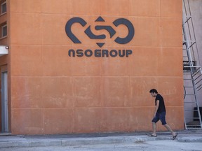 FILE - A logo adorns a wall on a branch of the Israeli tech company NSO Group, near the southern Israeli town of Sapir, Aug. 24, 2021. Shalev Hulio, the chief executive of embattled Israeli spyware maker NSO, has stepped down as part of a reorganization, the company announced Sunday, Aug. 21, 2022. NSO, maker of the powerful Pegasus phone surveillance software, has been connected to a number of scandals resulting from alleged misuse of its products by customers.