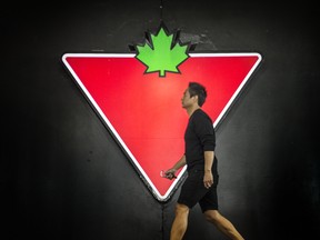 A shopper enters a Canadian Tire store in Toronto.