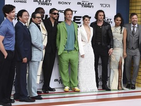The cast of "Bullet Train" pose on the red carpet at the film's premiere on Monday, Aug. 1, 2022, at the Regency Village Theatre in Los Angeles. Pictured from left is Logan Lerman, Masi Oka, Hiroyuki Sanada, Brian Tyree Henry, Bad Bunny, Brad Pitt, Joey King, Aaron Taylor-Johnson, Zazie Beetz and director David Leitch.
