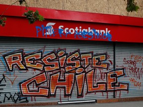 A Scotiabank gate is seen graffitied during a protest against Chile's government in Santiago, Chile, Nov. 1, 2019.