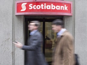 Scotiabank reported third-quarter net income of $2.59 billion, up from $2.54 billion in the same quarter last year. A branch of Scotiabank is pictured in downtown Toronto on Tuesday, April 10, 2018.