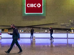 CIBC says it earned $1.67 billion in its third quarter, down from $1.73 billion in the same quarter last year. The new CIBC logo displayed the the lobby of its headquarters in Toronto on Monday, Oct. 25, 2021.