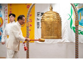 Dr. Hong, Tao-Tze, the leader of Tai Ji Men, rings the Bell of World Peace and Love in Washington, wishing for the awakening of conscience in everyone, as well as for global peace and sustainability. (AP Images)