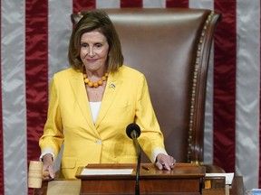 House Speaker Nancy Pelosi of Calif., finishes the vote to approve the Inflation Reduction Act in the House chamber at the Capitol in Washington, Friday, Aug. 12, 2022. A divided Congress gave final approval Friday to Democrats' flagship climate and health care bill.