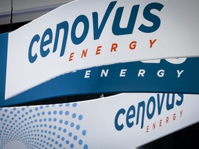Cenovus Energy logos are on display at the Global Energy Show in Calgary, Alta., Tuesday, June 7, 2022. Cenovus Energy Inc. has reached a deal with British energy giant BP to buy the remaining 50 per cent stake in the BP-Husky Toledo Refinery for $300 million.