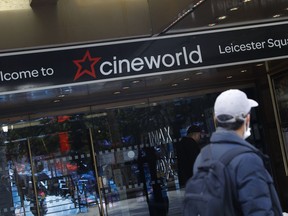 FILE - A man walks past a Cineworld cinema in Leicester Square, London, on Oct. 5, 2020. Cineworld Group PLC, the world's second-largest chain of movie theaters, said Monday Aug. 22, 2022 that it is considering filing for Chapter 11 bankruptcy protection in the U.S. and similar actions elsewhere.