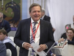 FILE - Former German Chancellor Gerhard Schroeder arrives to attend the St. Petersburg International Economic Forum in St. Petersburg, Russia, June 7, 2019. Local officials with German Chancellor Olaf Scholz's party rejected a bid to expel former Chancellor Gerhard Schroeder over his close ties to Russia, the news agency dpa reported Monday, Aug. 8, 2022. An arbitration committee of the center-left Social Democrats' branch in Hannover, where Schroeder lives, considered 17 applications from party members for proceedings against him.