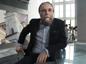 FILE - In this photo taken on Thursday, Aug. 11, 2016, Alexander Dugin, the neo-Eurasianist ideologue, sits in his TV studio in central Moscow, Russia. The daughter of this Russian nationalist ideologist who is often referred to as "Putin's brain", was killed when her car exploded on the outskirts of Moscow, officials said Sunday, Aug. 21, 2022.