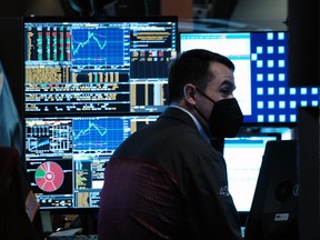 Traders work on the floor of the New York Stock Exchange.