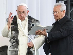 Pope Francis attends a public program with Inuit traditions in a plaza outside Nakasuk Elementary School in Iqaluit, Nunavut.