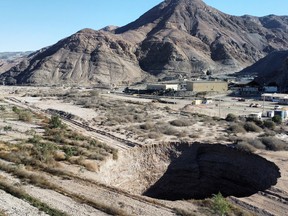 A sinkhole that was exposed last week has doubled in size, at a mining zone close to Tierra Amarilla town, in Copiapo, Chile, Aug. 7, 2022.