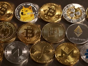 Representations of cryptocurrencies are seen in this illustration.