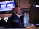 Traders work on the floor of the New York Stock Exchange during afternoon trading in New York City. 