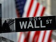 A sign for Wall Street outside the New York Stock Exchange in Manhattan.