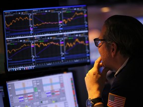 Traders work on the floor of the New York Stock Exchange during afternoon trading in New York City.