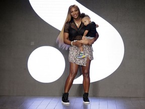 FILE - Serena Williams holds her daughter Alexis Olympia Ohanian Jr. after showing her clothing line during New York's Fashion Week in New York. Serena Williams says she is ready to step away from tennis after winning 23 Grand Slam titles, turning her focus to having another child and her business interests. "I'm turning 41 this month, and something's got to give," Williams wrote in an essay released Tuesday, Aug. 9, 2022, by Vogue magazine.