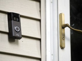 FILE - A Ring doorbell camera is displayed outside a home in Wolcott, Conn., on July 16, 2019. Two Amazon-owned companies -- Ring and Hollywood studio MGM -- are teaming up to create a TV show in the mold of "America's Funniest Home Videos" using viral footage from Ring's doorbell and smart-home cameras. The half-hour show, called "Ring Nation," will premier in syndication on Sept. 26, 2022, MGM said.