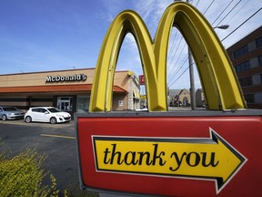 A sign is shown in front of an McDonald's restaurant in Pittsburgh on Saturday, April 23, 2022. The Chicago-based company said, Tuesday, July 26, it had net income of $1.60 per share. Earnings, adjusted for non-recurring costs, came to $2.55 per share. The results surpassed Wall Street expectations.