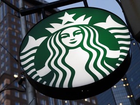 FILE - A Starbucks sign hangs outside a Starbucks coffee shop in downtown Pittsburgh on June 26, 2019. The National Labor Relations Board says Starbucks is violating U.S. labor law by withholding pay hikes and other benefits from stores that have voted to unionize. The labor board's Seattle office filed the complaint late Wednesday, Aug. 24, 2022.