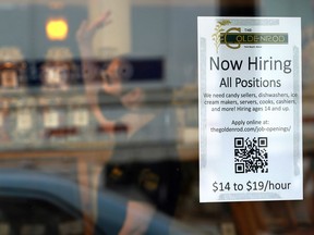FILE - A sign advertises for help The Goldenrod, a popular restaurant and candy shop, Wednesday, June 1, 2022, in York Beach, Maine. America's hiring boom continued in July as employers added a surprising 528,000 jobs despite raging inflation and rising anxiety about a recession.