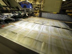 FILE - Sheets of uncut $100 run through a printing press at the Bureau of Engraving and Printing Western Currency Facility in Fort Worth, Texas, on Sept. 24, 2013. Retirement can loom like a dark cloud for small-business owners. Many invest blood, sweat and tears -- and every penny -- into building their business but never set cash aside for the future. A huge number of entrepreneurs have reported putting aside no retirement savings at all. For some, selling the business is their only retirement plan.