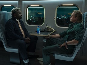 This image released by Sony Pictures shows Bryan Tyree Henry, left, and Brad Pitt in a scene from "Bullet Train."