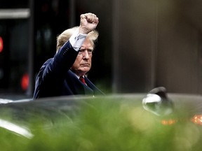 Former President Donald Trump gestures as he departs Trump Tower, Wednesday, Aug. 10, 2022, in New York, on his way to the New York attorney general's office for a deposition in a civil investigation.