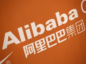 FILE - In this Sept. 19, 2014, photo, the Alibaba logo is displayed during the company's IPO at the New York Stock Exchange. The U.S. and China have reached a preliminary agreement to allow U.S. regulators to inspect the audits of China-based companies whose stocks are traded on U.S. exchanges. The deal was announced Friday, Aug. 26, 2022.