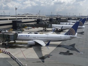 FILE - United Airlines planes are parked at gates at Newark Liberty International Airport in Newark, N.J., on July 1, 2020. On Monday, Aug. 15, 2022, the Federal Aviation Administration said that it was reducing flights in the area around New York City because of lack of staffing. Departing and arriving flights could be delayed up to two hours at John F. Kennedy International, LaGuardia and Newark Liberty International airports.