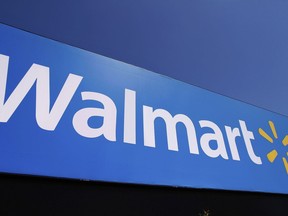 FILE - The Walmart logo is displayed on a store in Springfield, Ill., May 16, 2011. Walmart filed a motion on Monday, Aug. 29, 2022, to dismiss a lawsuit by the Federal Trade Commission in June that accused the nation's largest retailer of allowing its money transfer services to be used by scam artists, calling it an "egregious instance of agency overreach."