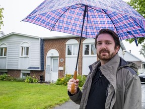 Alexander Nachaj is seen in front of his new home in Saint-Hyacinthe, Que., on Tuesday, August 23, 2022. When Nachaj needed to wire a down payment on a house, he didn't worry much about it and went down to his local bank to send it along to the notary but wasn't expecting what happened next.