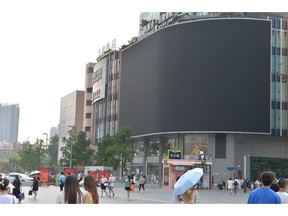 A screen is shut down to save energy in Chengdu, Sichuan province, on Aug. 17. Photographer: STR/AFP/Getty Images
