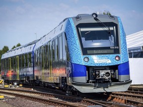 A hydrogen-powered regional train stands at Bremervoerde station, Germany, Wednesday, Aug. 24, 2022. In the fight against climate change, 14 hydrogen trains are to replace the current diesel trains. In Bremervoerde, a trial operation with two prototypes ran successfully between fall 2018 and February 2020.