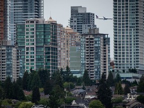 Condo towers are seen in the Metrotown area of Burnaby, B.C. on May 30, 2021. Canadians eager to buy a home as the real estate market cools might find themselves considering micro-condos, but mortgage brokers say if you're thinking small, prepare for extra caveats when seeking financing.