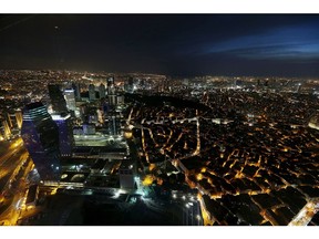 Skyscrapers and buildings stand illuminated at night on the city skyline seen from the Sapphire viewing platform in Istanbul. Turkey, which imports some 70 percent of its total energy needs, is increasing domestic power production as it seeks to narrow the largest current-account gap among developing nations.