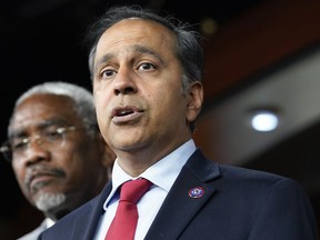 FILE - Rep. Raja Krishnamoorthi, D-Ill., speaks as Rep. Gregory Meeks, D-N.Y., listens during a news conference on Capitol Hill, Aug. 10, 2022, in Washington. Krishnamoorthi, head of the Economic and Consumer Policy subcommittee, on Aug. 30, asked leaders of the Treasury Department, Securities and Exchange Commission, Commodity Futures Trading Commission, and Federal Trade Commission for more information on the steps they are taking to curb the growth of fraud and consumer abuse linked to cryptocurrencies