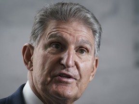 Sen. Joe Manchin, D-W.Va., speaks to reporters at the Capitol in Washington, Aug. 1, 2022. Republicans see inflation, taxes and immigration as Democratic weak spots worth attacking, and two opposition senators as prime targets, in the upcoming battle over an economic package the Democrats want to push through the Senate.