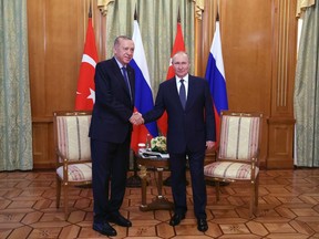 Russian President Vladimir Putin, right, and Turkish President Recep Tayyip Erdogan pose for a photo prior to their talks at the Rus sanatorium in the Black Sea resort of Sochi, Russia, Friday, Aug. 5, 2022. Turkish President Recep Tayyip Erdogan traveled to Russia Friday for talks with Russian President Vladimir Putin expected to focus on a grain deal brokered by Turkey, prospects for talks on ending hostilities in Ukraine, and the situation in Syria.