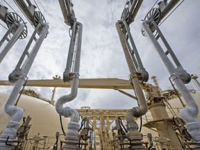 Liquefied natural gas (LNG) dispenses through pipes on-board the Gallina LNG tanker after docking at the National Grid Plc's Grain LNG plant on the Isle of Grain in Rochester, U.K., on Saturday, March 4, 2017. The shipment to England on the Gallina was priced using the U.K.'s National Balancing Point, where front-month gas cost about $7 a million British thermal units on Feb. 7. Photographer: Bloomberg/Bloomberg