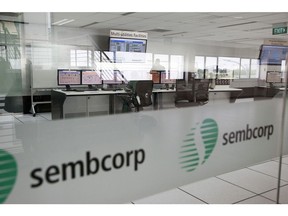 A worker sits at computer monitors inside the central control room of the Global Asset Management System (GAMS) at Sembcorp Industries Ltd.'s Technology and Innovation Center on Jurong Island in Singapore, on Friday, March 31, 2017. GAMS enables the management of Sembcorp's facilities around the world through advanced data analytics for process optimisation, troubleshooting and predictive maintenance. Photographer: Ore Huiying/Bloomberg