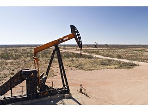 Pumpjacks operate on oil wells in the Permian Basin in this aerial photograph taken over Crane, Texas, U.S., on Friday, March 2, 2018. Chevron, the world's third-largest publicly traded oil producer, is spending $3.3 billion this year in the Permian and an additional $1 billion in other shale basins. Its expansion will further bolster U.S. oil output, which already exceeds 10 million barrels a day, surpassing the record set in 1970.