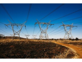 Electrical power lines hang from transmission pylons in the Tembisa township outside Johannesburg.